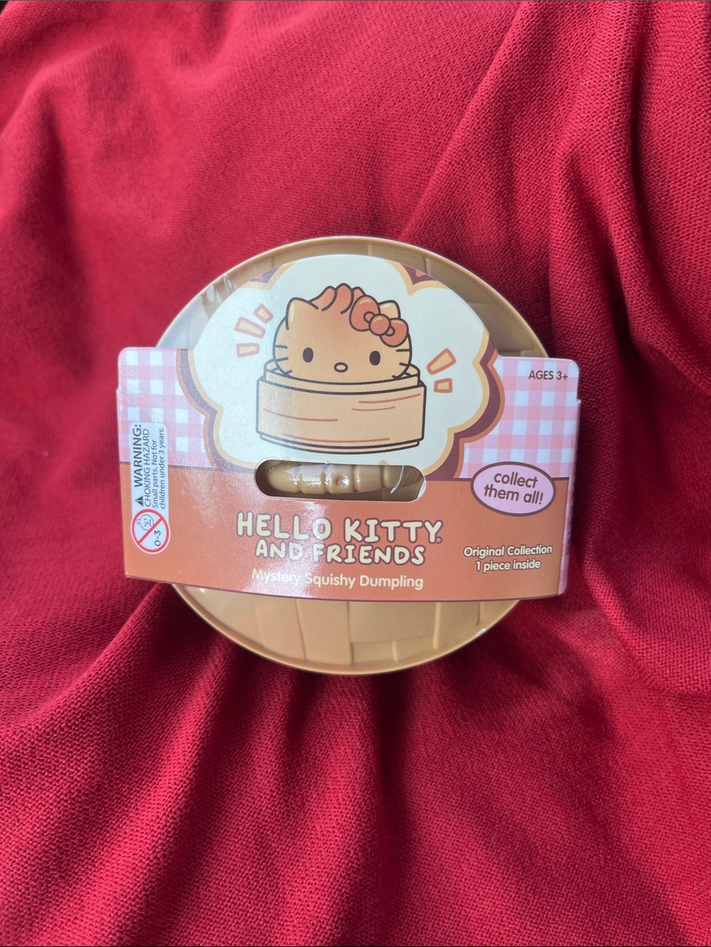 Hello Kitty Mystery Squishy Dumpling in Tan and Pink Packaging